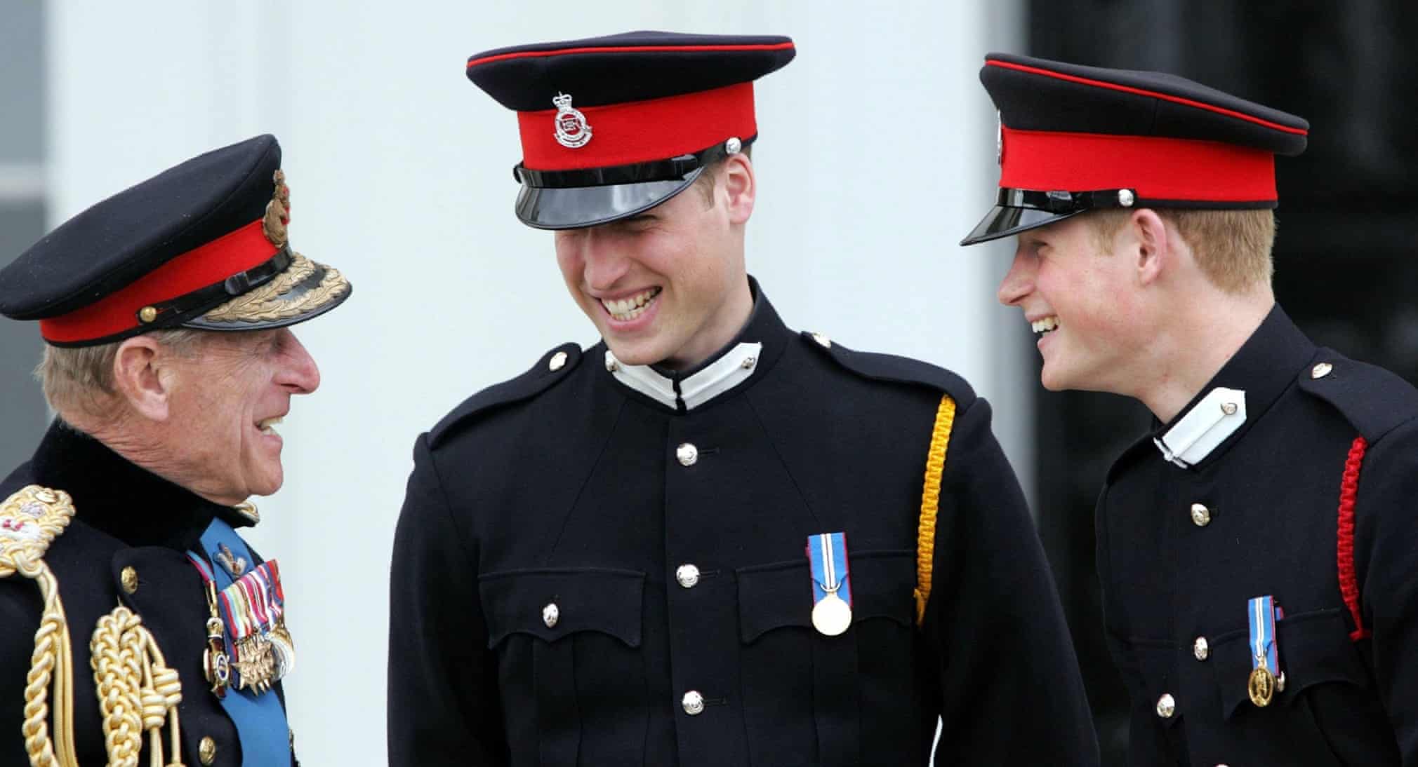 The Duke of Edinburgh speaks to princes William and Harry at Sandhurst after the sovereign’s parade in April 2006. The parade marked the completion of Harry’s officer training. Photograph: PA