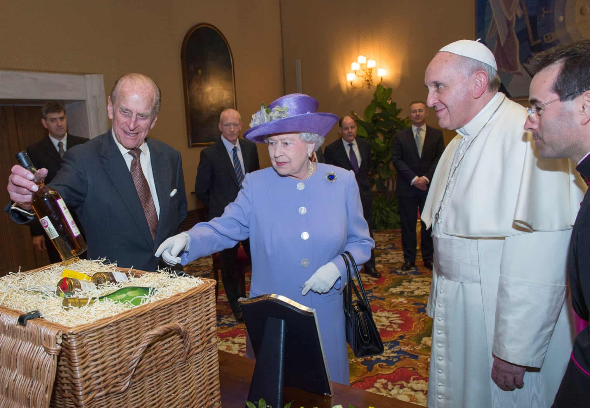 The royal couple look at a gift from Pope Francis during their visit to the Vatican in April 2014. Photograph: Arthur Edwards/The Sun/PA