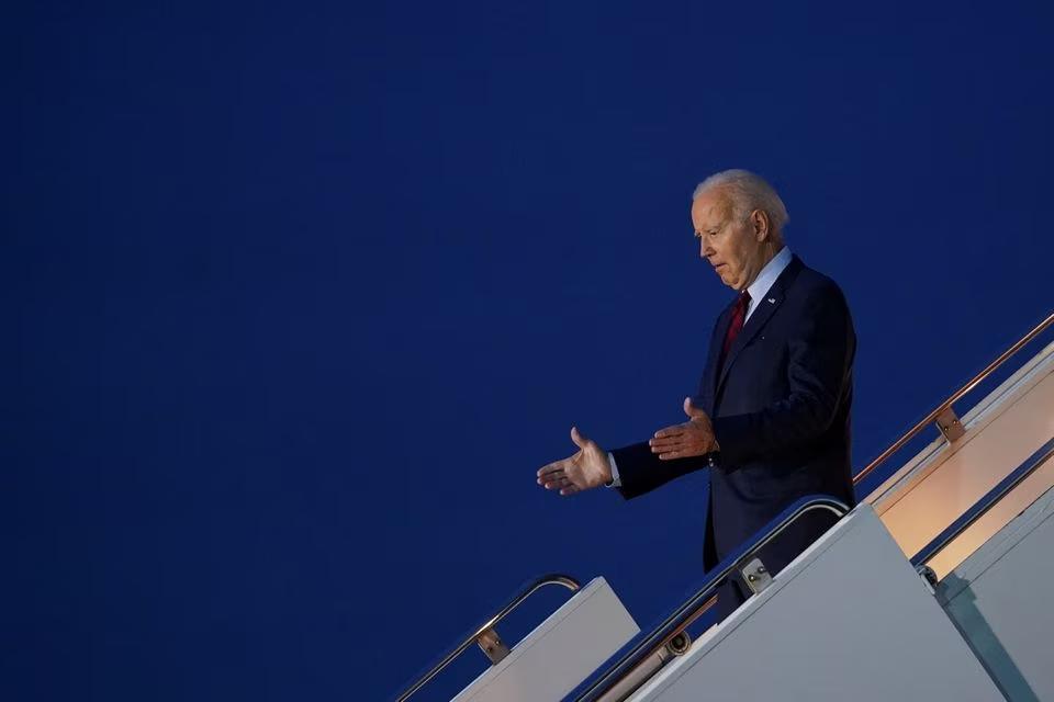U.S. President Joe Biden disembarks Air Force One as he visits Britain, at Stansted Airport, Britain, July 9, 2023. REUTERS/Kevin Lamarque